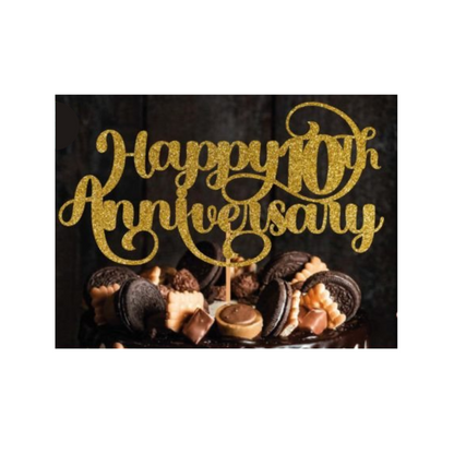 Cake topper with the words: Happy 10th Anniversary in glitter against a dark background inserted into a cake. Cake topper can be made in different colours. 