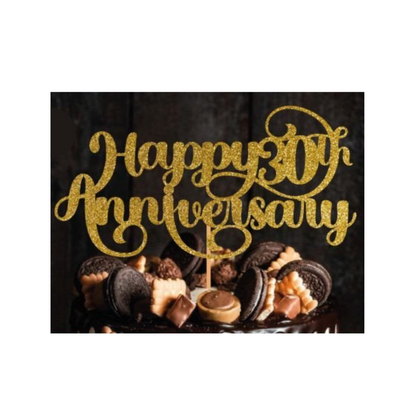 Cake topper with the words: Happy 30th Anniversary in glitter against a dark background inserted into a cake. Cake topper can be made in different colours. 