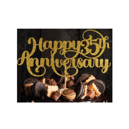 Cake topper with the words: Happy 35th Anniversary in glitter against a dark background inserted into a cake. Cake topper can be made in different colours. 