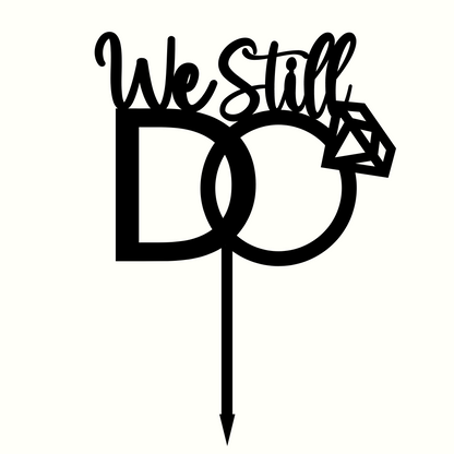 Celebratory cake topper with the words "We Still Do" in elegant script font, perfect for anniversary or vow renewal cakes.