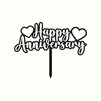 Cake topper with the words: Happy Anniversary  and a love heart on either side in black against a white background. Cake topper can be made in different colours. 